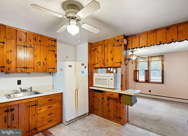 a bathroom with a sink a mirror and a shower