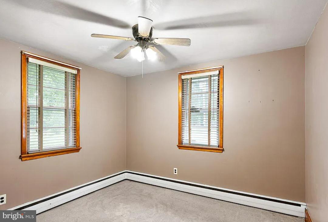 2445 Kenton Road Dover, DE 19904 - Photo 19 of 20 an empty room with windows and fan