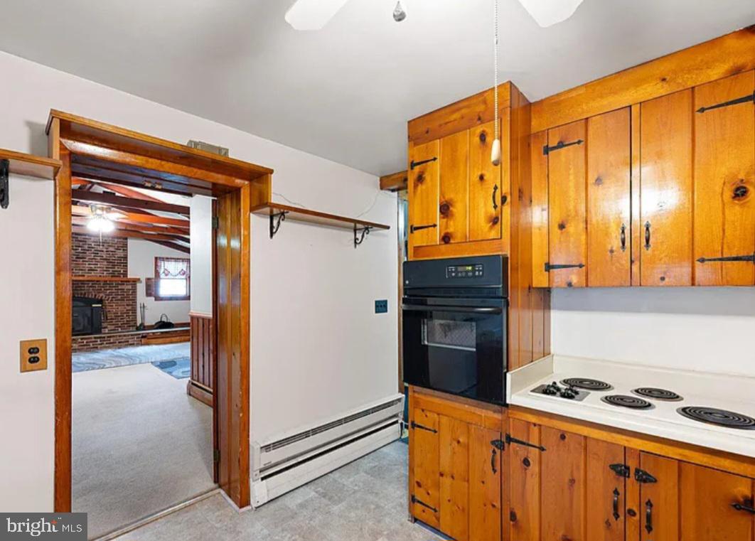 2445 Kenton Road Dover, DE 19904 - Photo 7 of 20 a kitchen with stainless steel appliances granite countertop a stove and a refrigerator