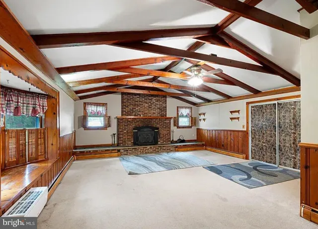 a view of a room with furniture and fireplace