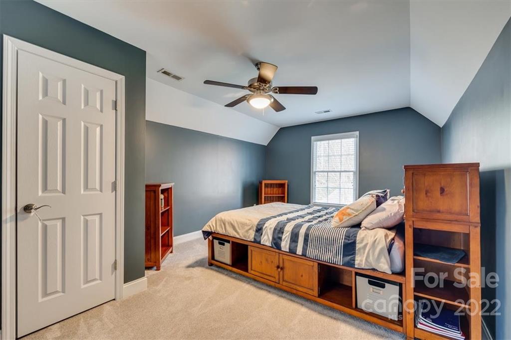 916 Cove Point Lane Tega Cay, SC 29708 - Photo 31 of 48 a bedroom with bed and a window