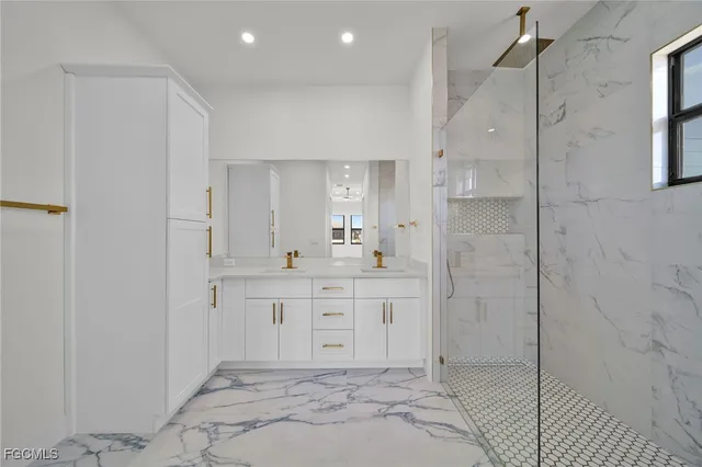 a spacious bathroom with a shower and a sink