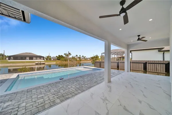a view of swimming pool with seating space