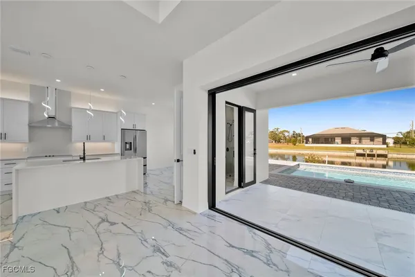 a open kitchen with granite countertop a sink and cabinets