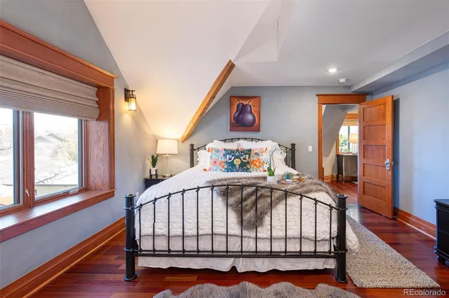 a bedroom with furniture and a window