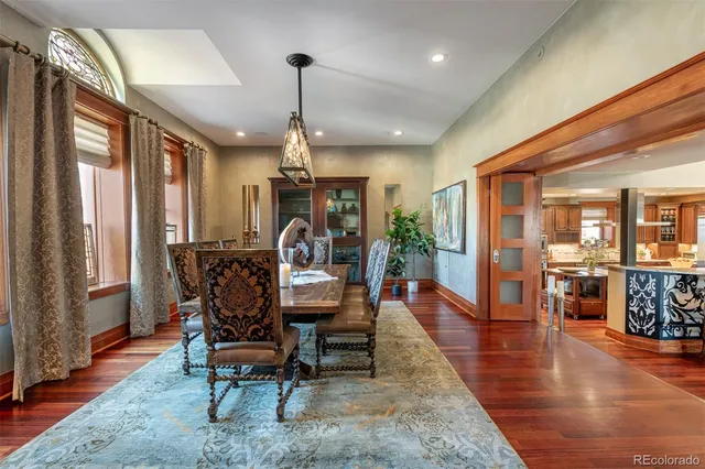 a view of a livingroom with furniture window and wooden floor