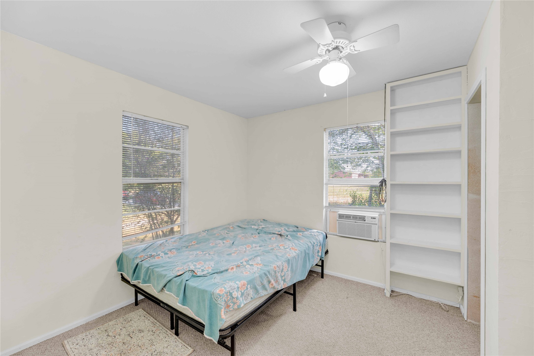 20235 Engelmann Lane Manor, TX 78653 - Photo 11 of 34 Bedroom featuring light colored carpet and ceiling fan