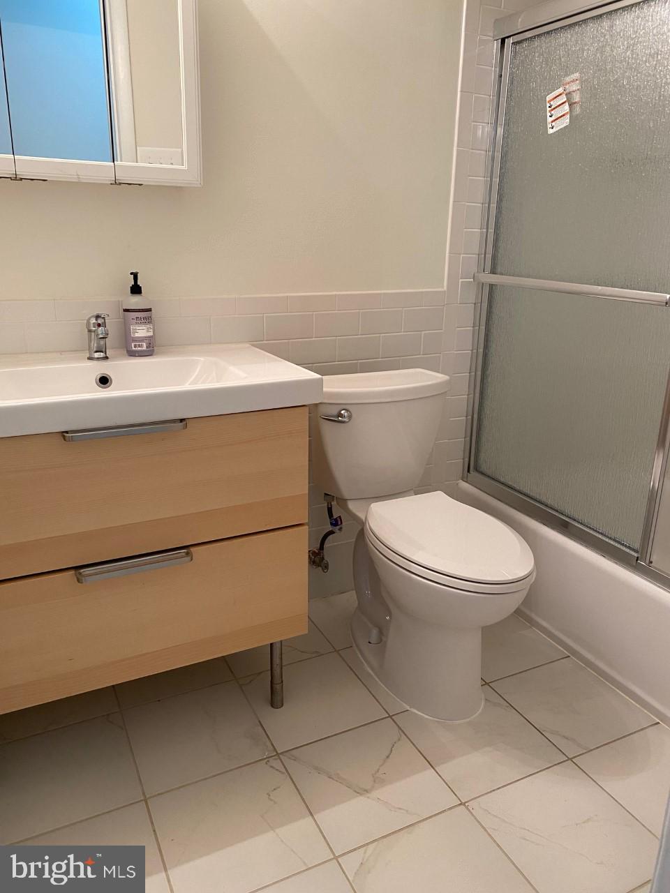 8316 Tobin Road, Unit 13 Annandale, VA 22003 - Photo 4 of 11 a bathroom with a toilet sink and vanity
