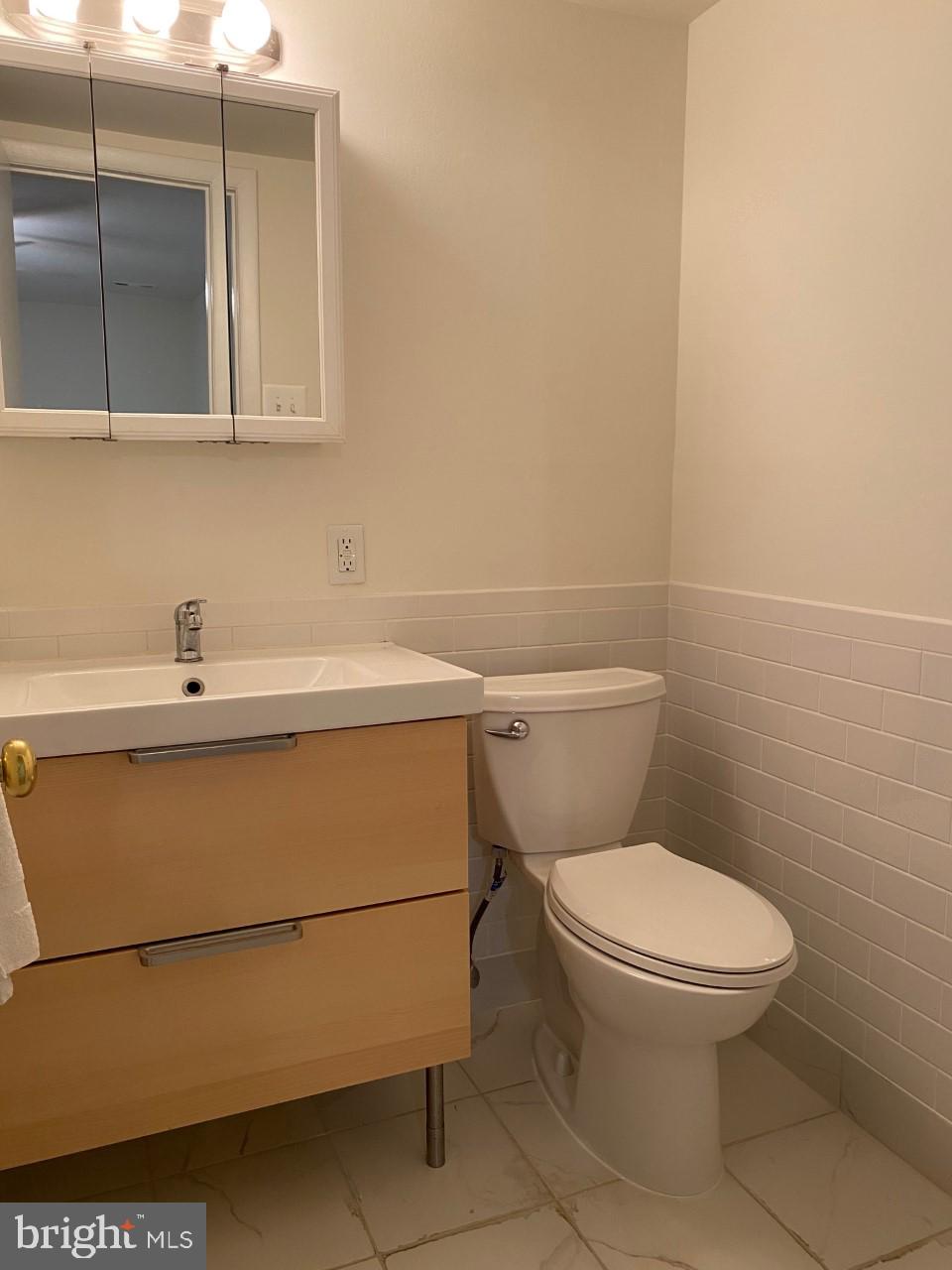 8316 Tobin Road, Unit 13 Annandale, VA 22003 - Photo 5 of 11 a bathroom with a toilet and a sink