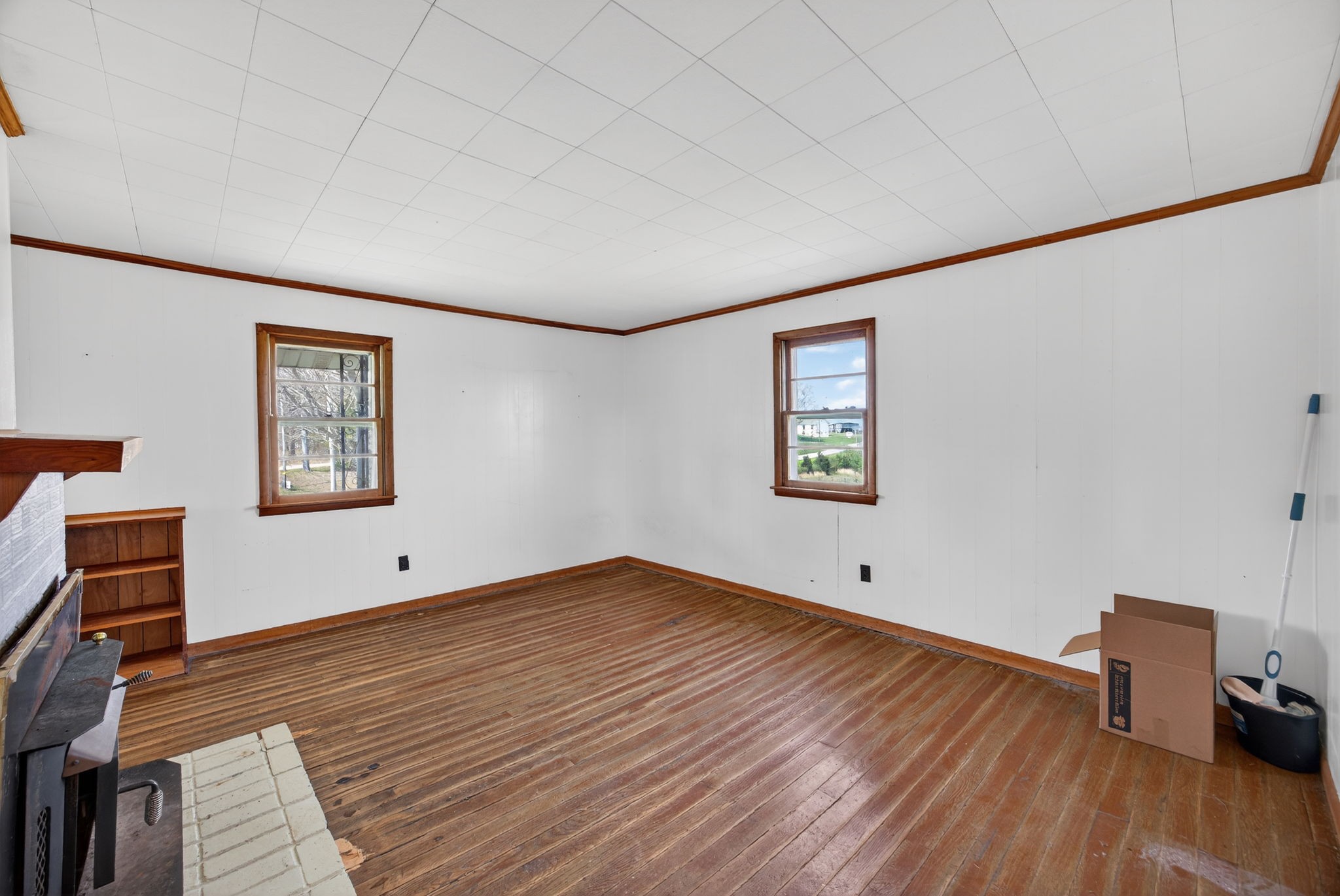 1298 South Bunker Hill Road Sparta, TN 38583 - Photo 8 of 35 a view of an empty room with wooden floor and a window
