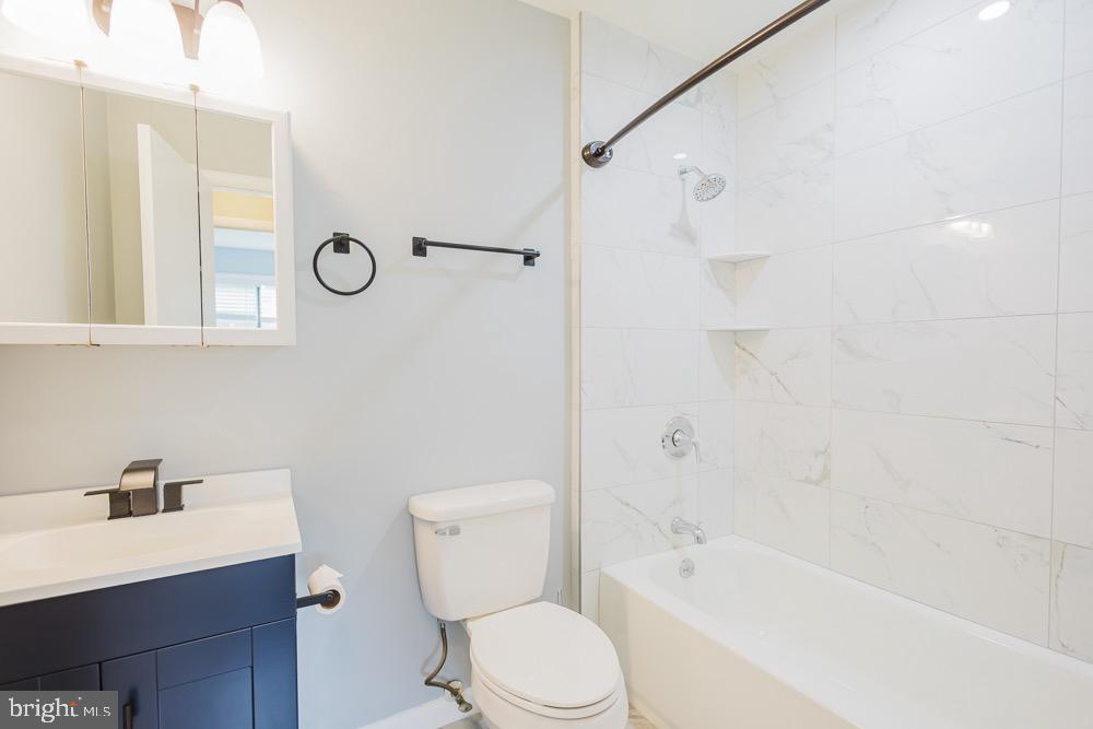 5764 Thunder Hill Road Columbia, MD 21045 - Photo 15 of 16 a white toilet sitting next to a bath tub