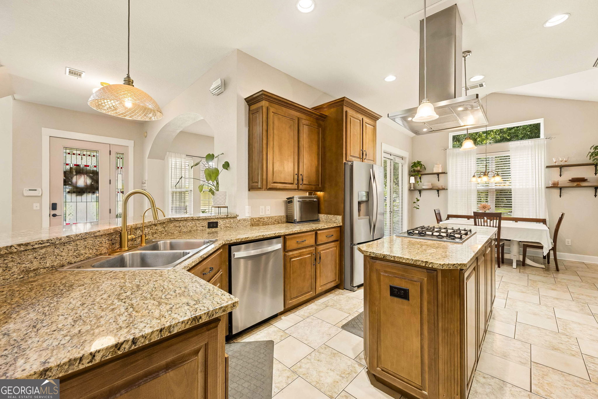 706 Hopewell Point Road White Oak, GA 31568 - Photo 16 of 84 The spacious kitchen opens effortlessly into the dining area, creating the perfect layout for family meals, holiday gatherings, and entertaining guests.