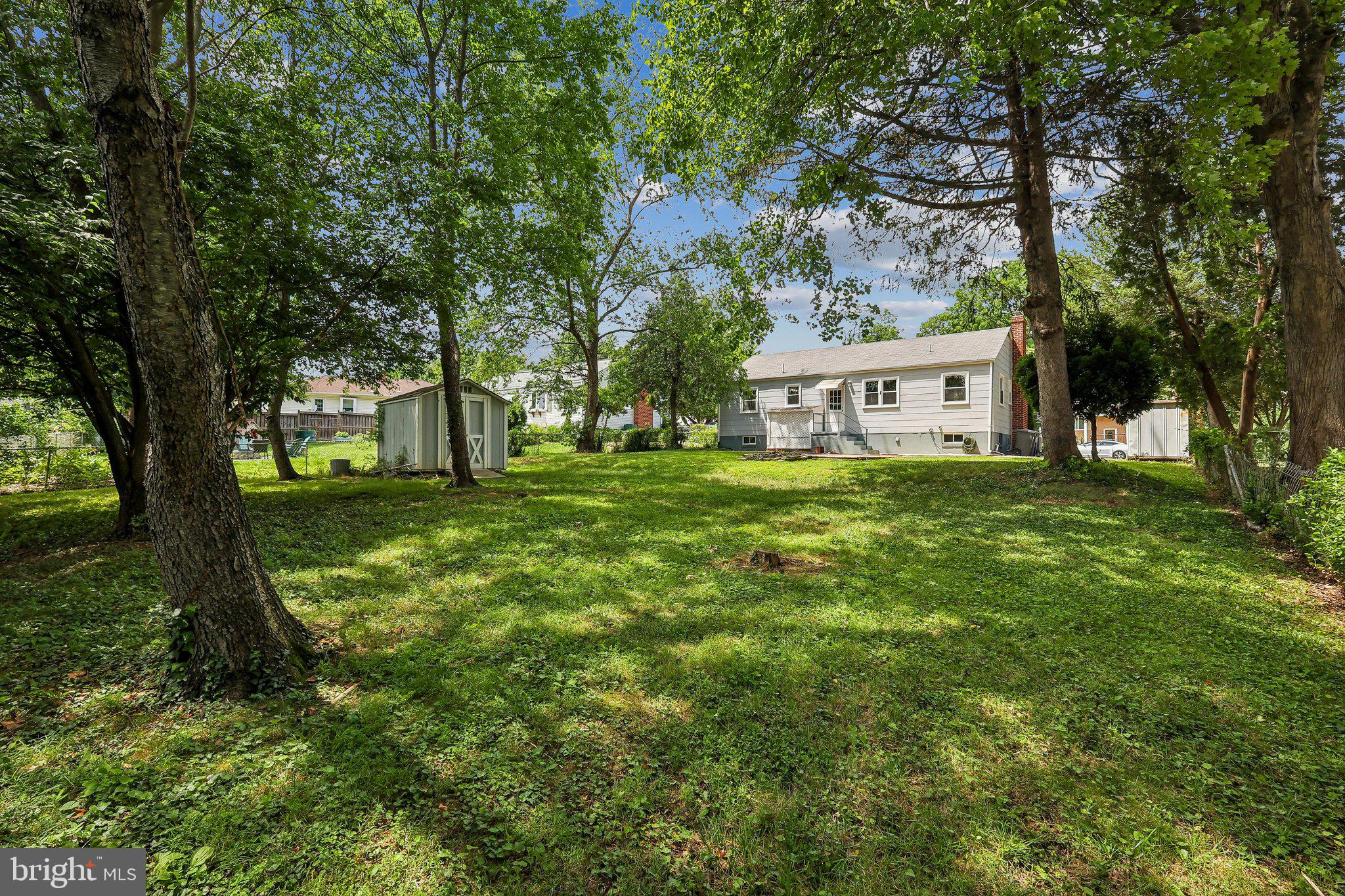 10217 Rodgers Road Fairfax, VA 22030 - Photo 27 of 27 Backyard with mature trees and 2 sheds