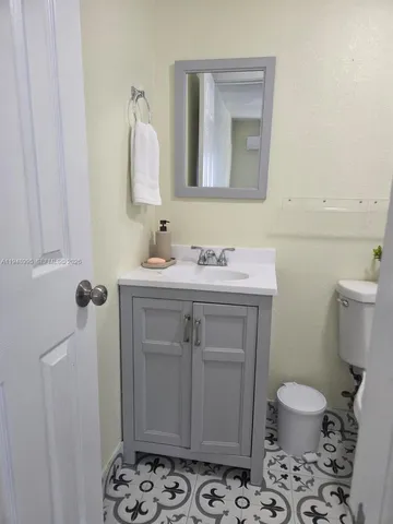 a bathroom with a shower and a toilet
