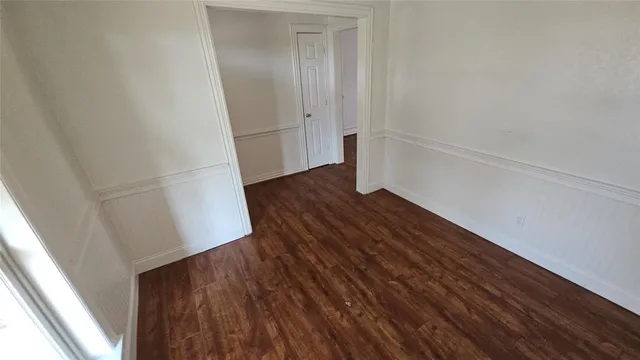 a view of walk in closet with wooden floor