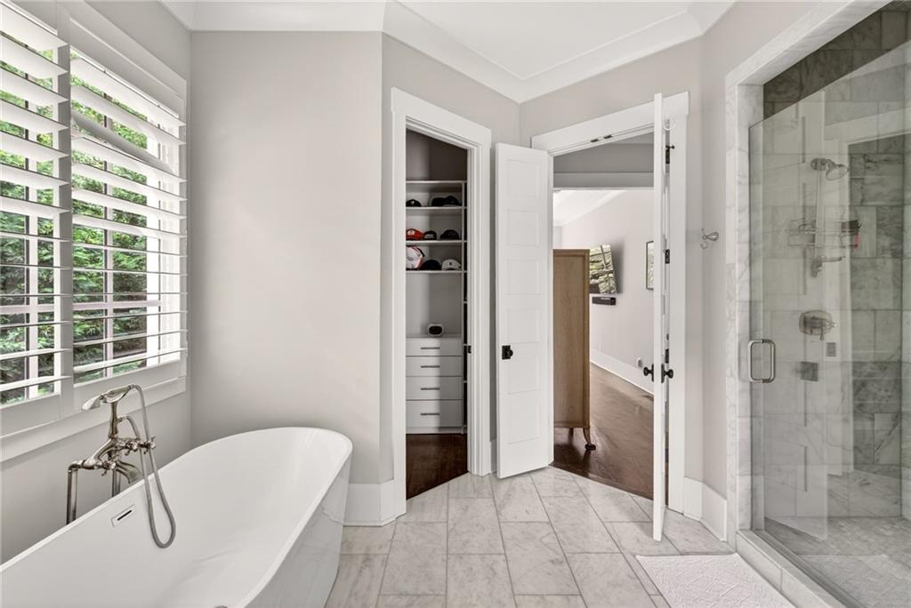 13460 New Providence Road Milton, GA 30004 - Photo 15 of 60 a bathroom with a tub shower and sink