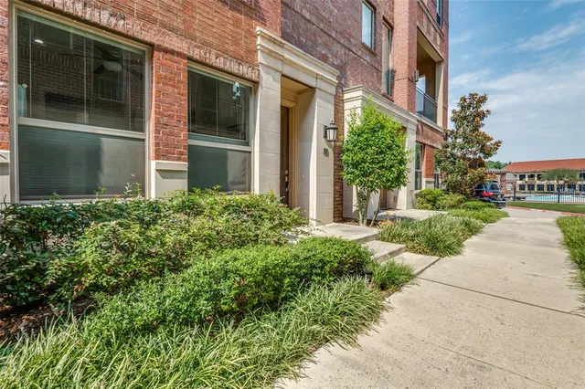 a view of a building with a yard