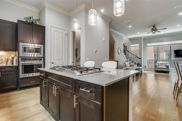 a kitchen with a sink stove and refrigerator