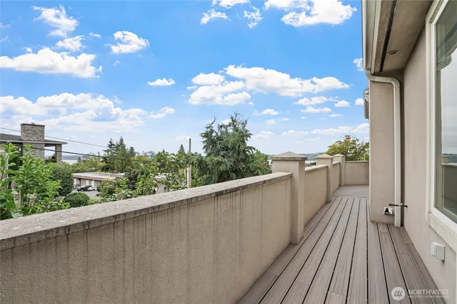 a view of a balcony with wooden floor