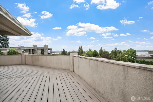 a view of balcony with wooden floor and city view