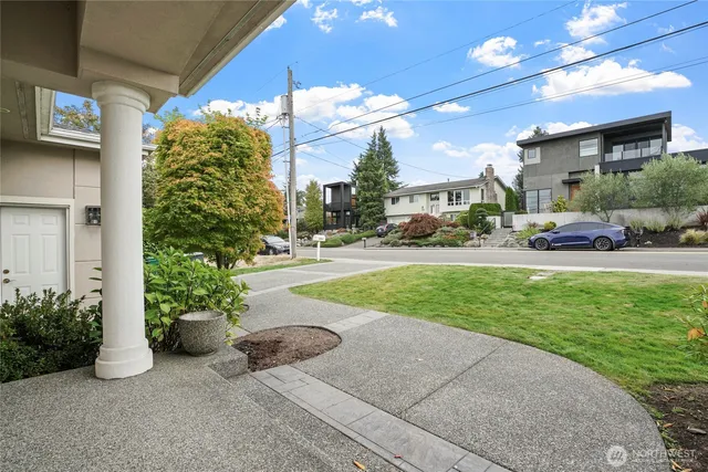 a view of a porch with a bench and plants