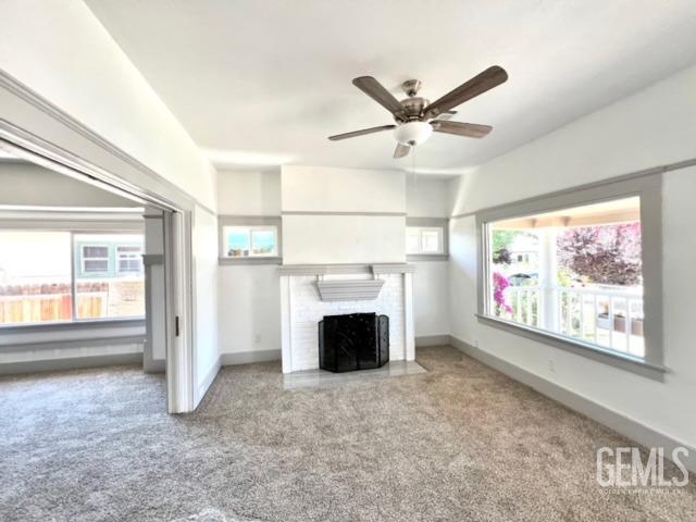 Undisclosed Address Bakersfield, CA 93304 - Photo 11 of 38 wooden floor fireplace and windows in an empty room