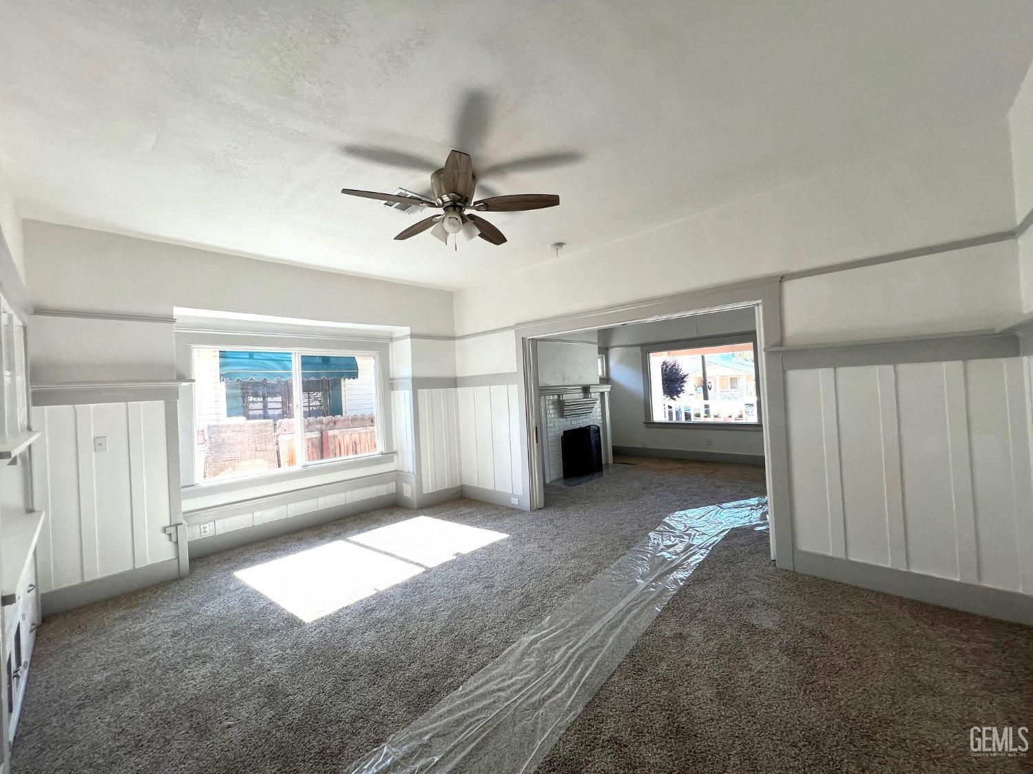 Undisclosed Address Bakersfield, CA 93304 - Photo 14 of 38 a view of livingroom with hardwood floor and a ceiling fan