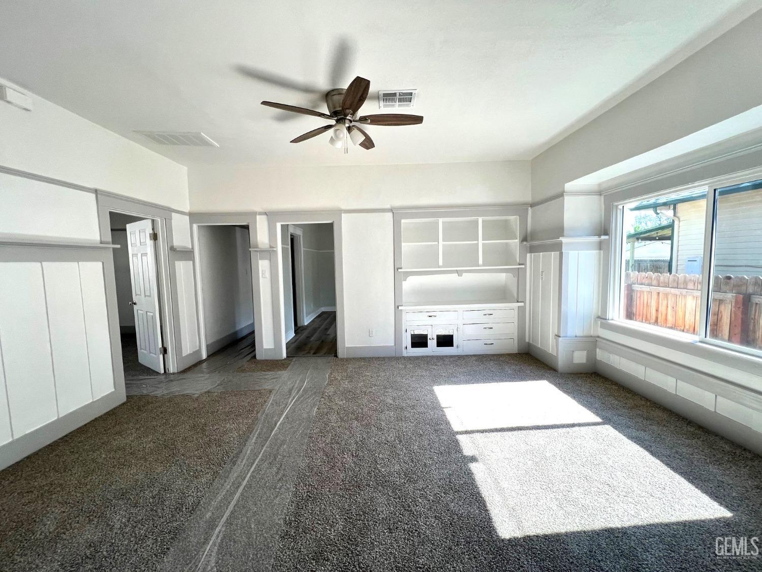 Undisclosed Address Bakersfield, CA 93304 - Photo 16 of 38 a view of a livingroom with a staircase