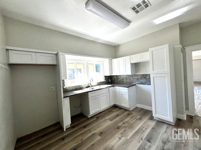 Undisclosed Address Bakersfield, CA 93304 - Photo 19 of 38 a kitchen with granite countertop white cabinets and white appliances