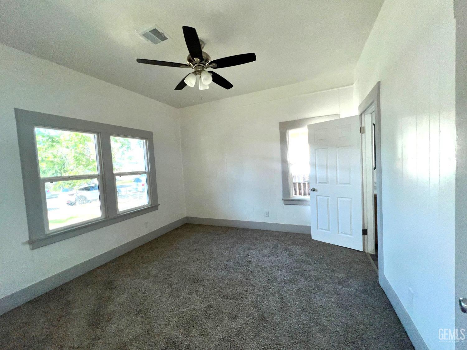 Undisclosed Address Bakersfield, CA 93304 - Photo 20 of 38 wooden floor in an empty room with a window
