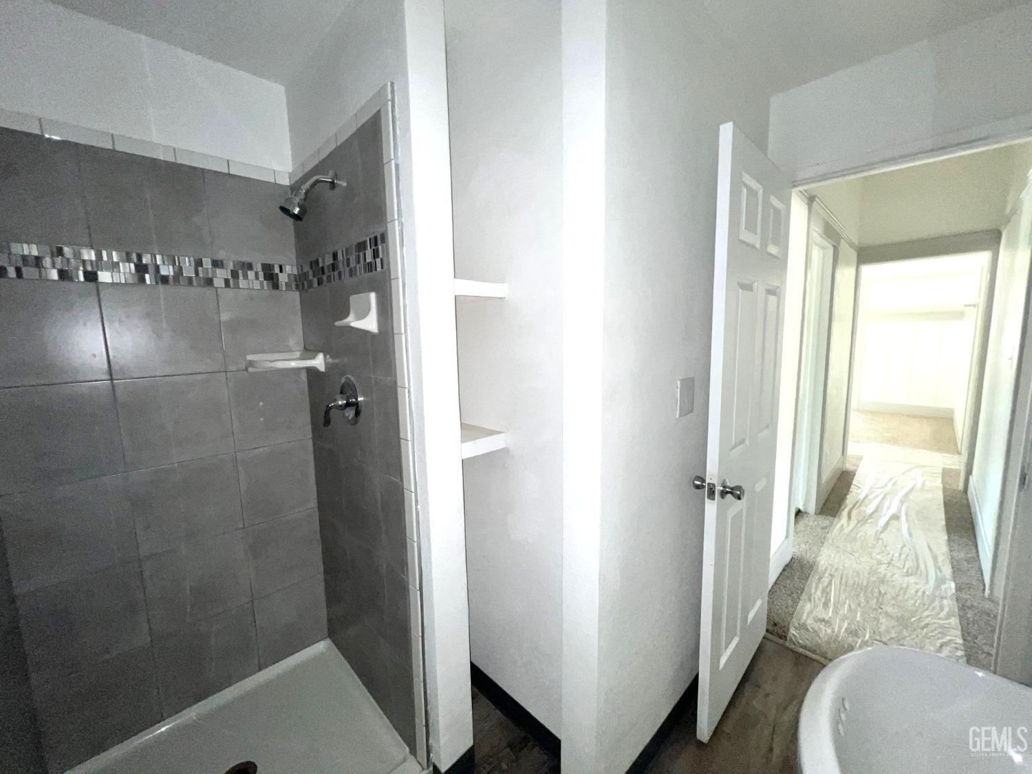 Undisclosed Address Bakersfield, CA 93304 - Photo 24 of 38 a bathroom with a shower and toilet