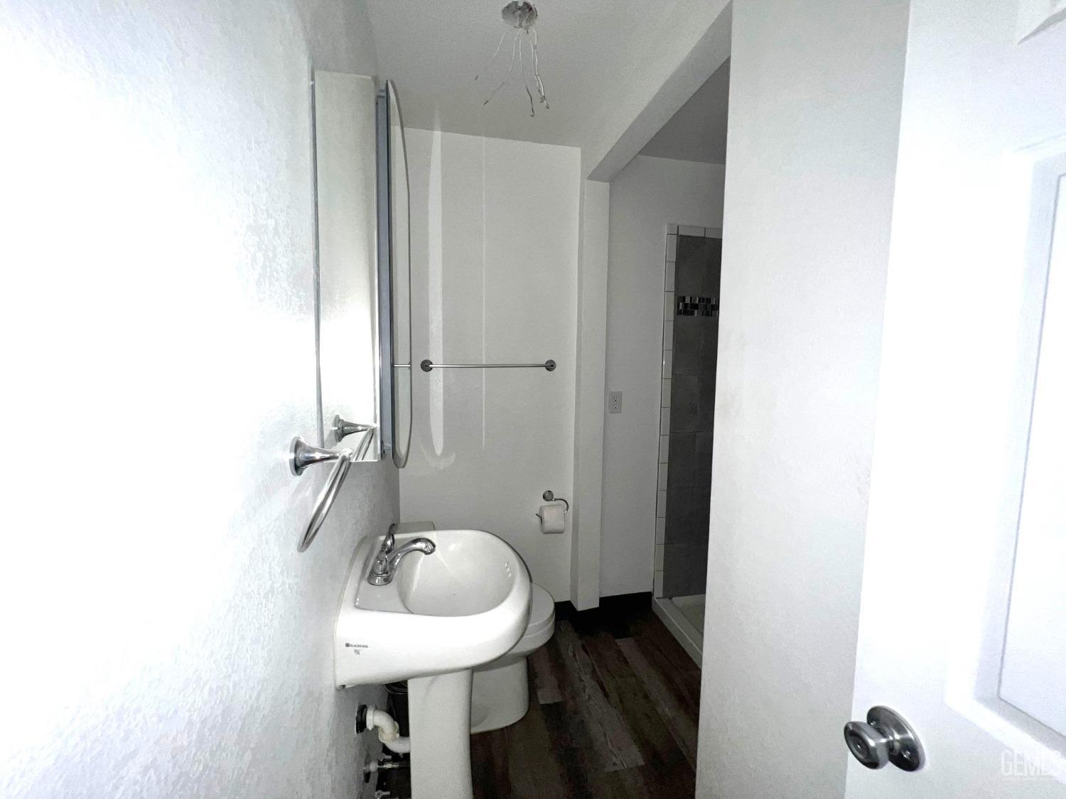 Undisclosed Address Bakersfield, CA 93304 - Photo 29 of 38 a bathroom with a sink and a mirror