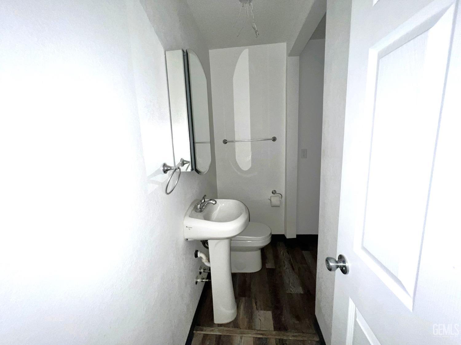 Undisclosed Address Bakersfield, CA 93304 - Photo 30 of 38 a bathroom with a sink and toilet