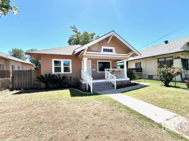 Undisclosed Address Bakersfield, CA 93304 - Photo 3 of 38 a front view of a house with a yard outdoor seating and mountain view
