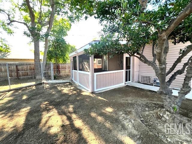 Undisclosed Address Bakersfield, CA 93304 - Photo 34 of 38 a view of a house with a yard