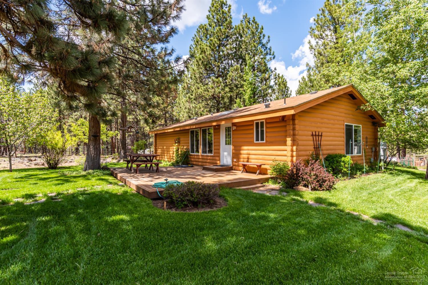 19047 Choctaw Road Bend, OR 97702 - Photo 18 of 23 a view of a house with backyard and sitting area