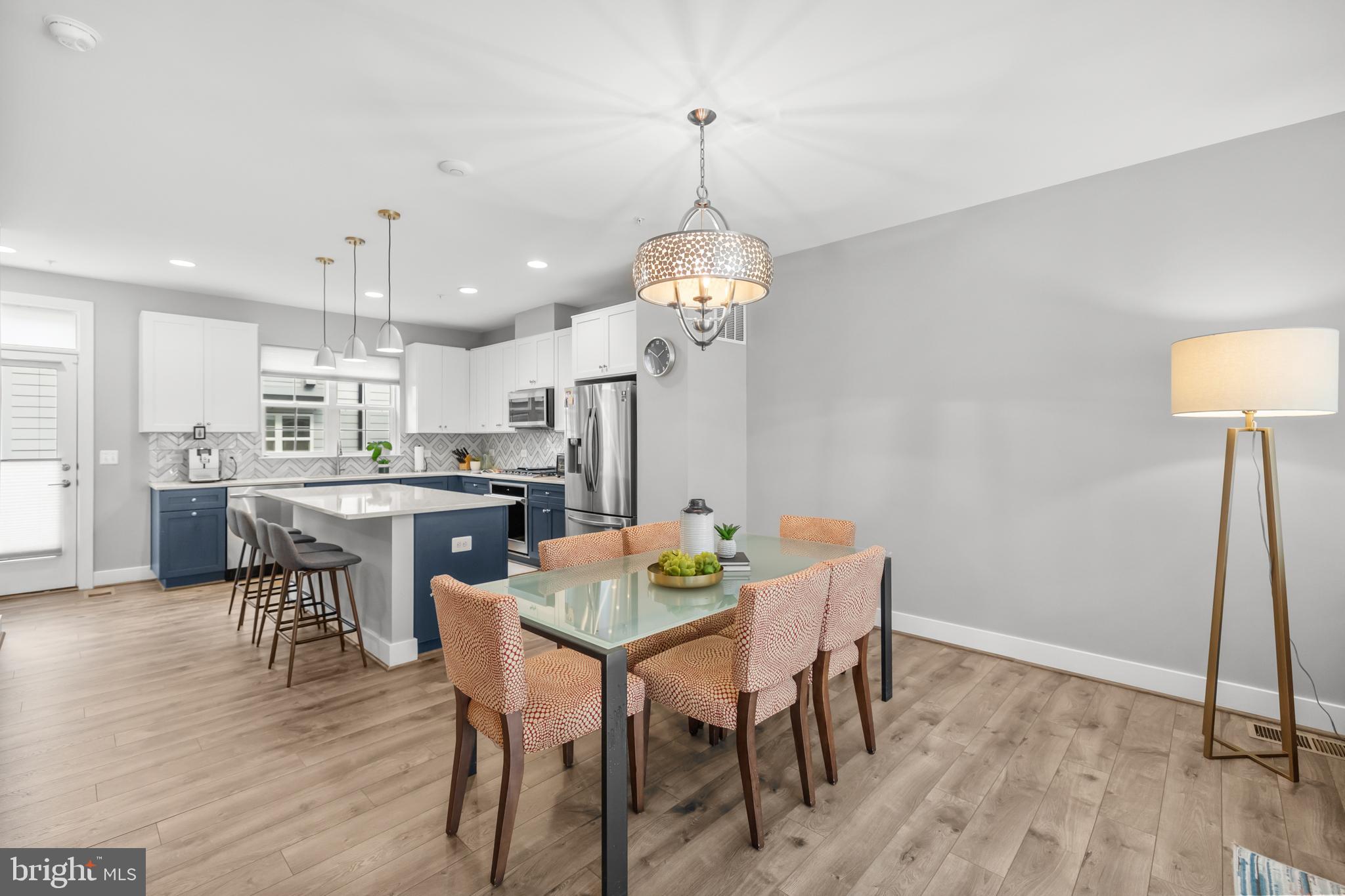 11226 Beaker Street Reston, VA 20190 - Photo 13 of 53 a view of a dining room with furniture and wooden floor