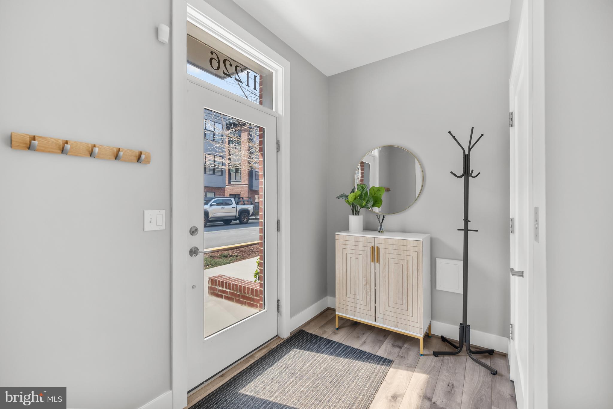 11226 Beaker Street Reston, VA 20190 - Photo 14 of 53 a view of an entryway with wooden floor