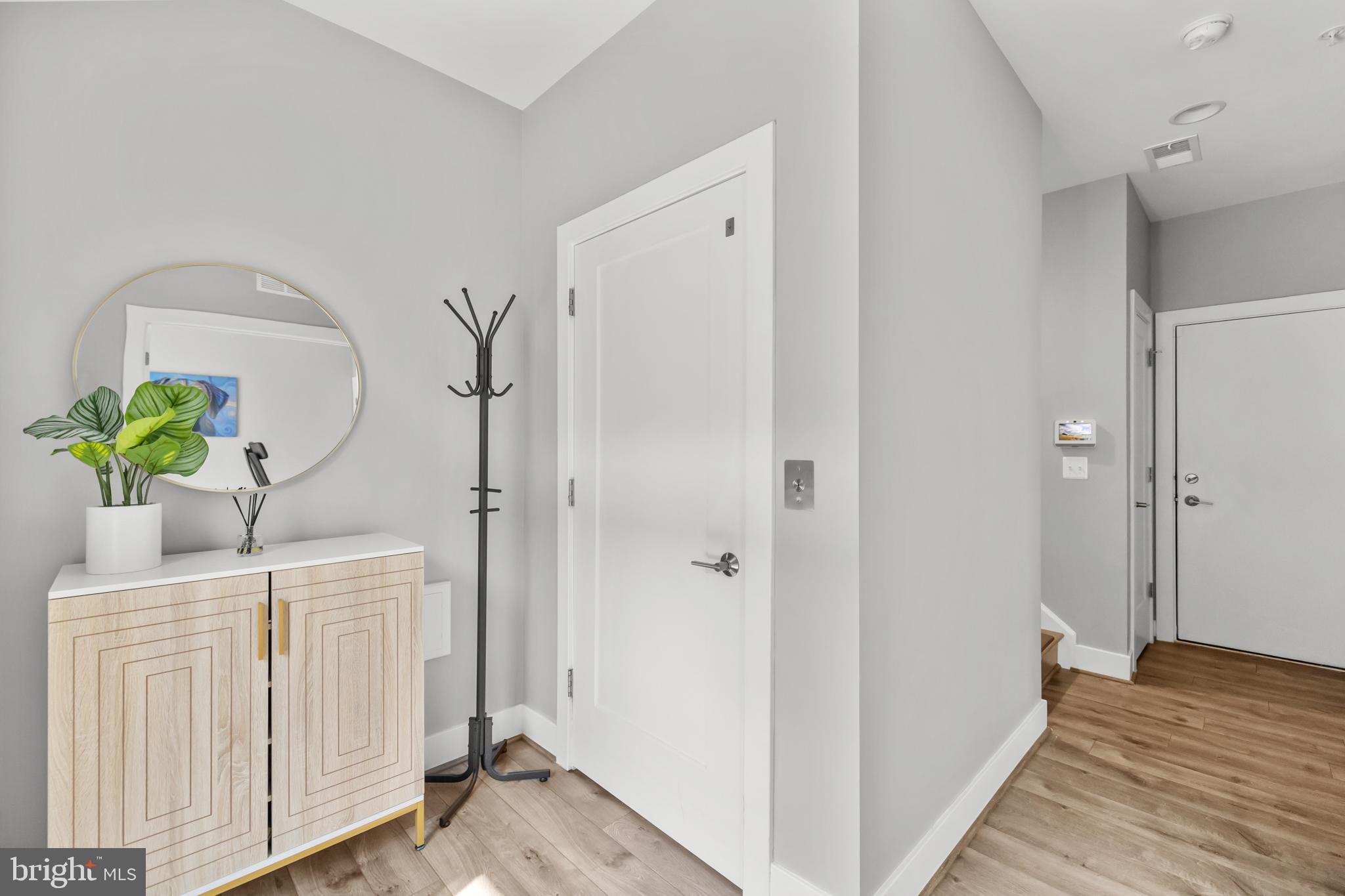 11226 Beaker Street Reston, VA 20190 - Photo 15 of 53 a view of hallway with wooden floor