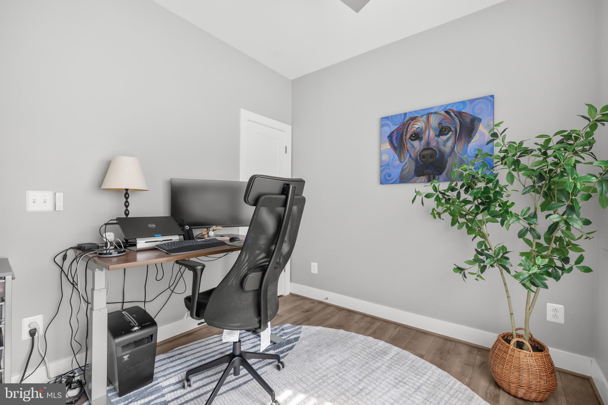 11226 Beaker Street Reston, VA 20190 - Photo 17 of 53 a view of a workspace with furniture and a potted plant