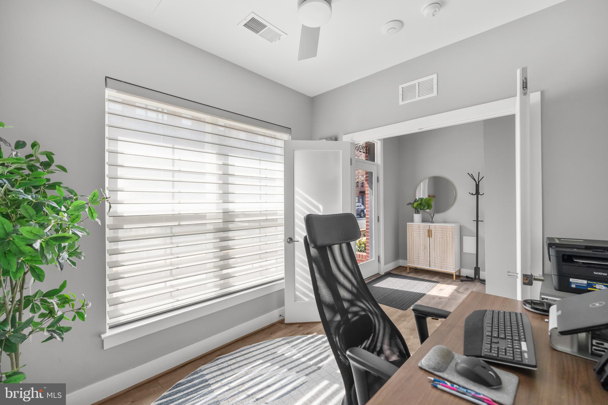 11226 Beaker Street Reston, VA 20190 - Photo 18 of 53 a view of a workspace with furniture and a potted plant
