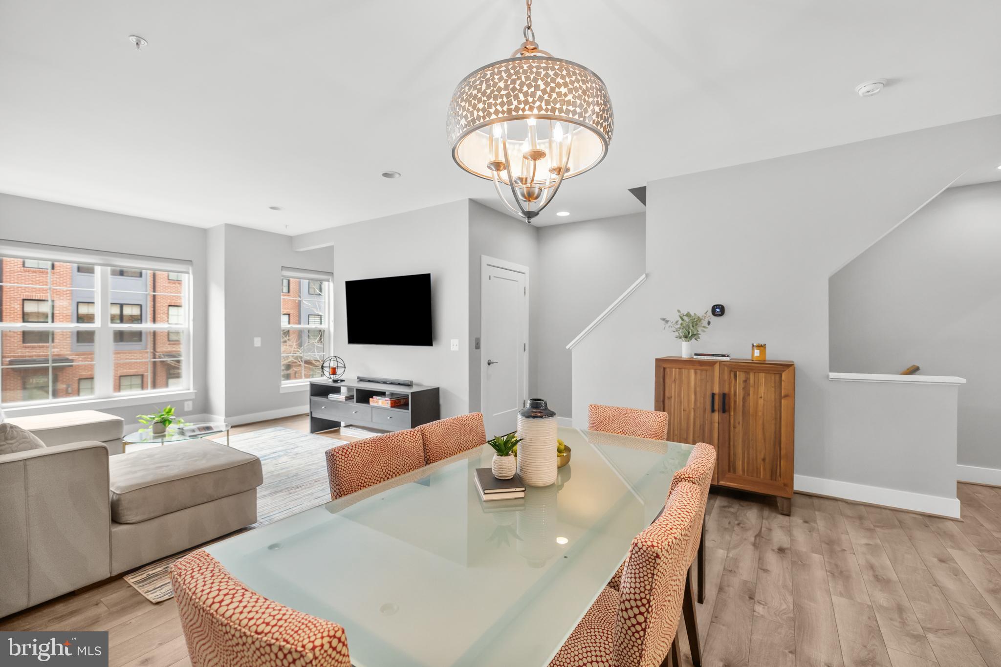 11226 Beaker Street Reston, VA 20190 - Photo 23 of 53 a living room with furniture and a flat screen tv