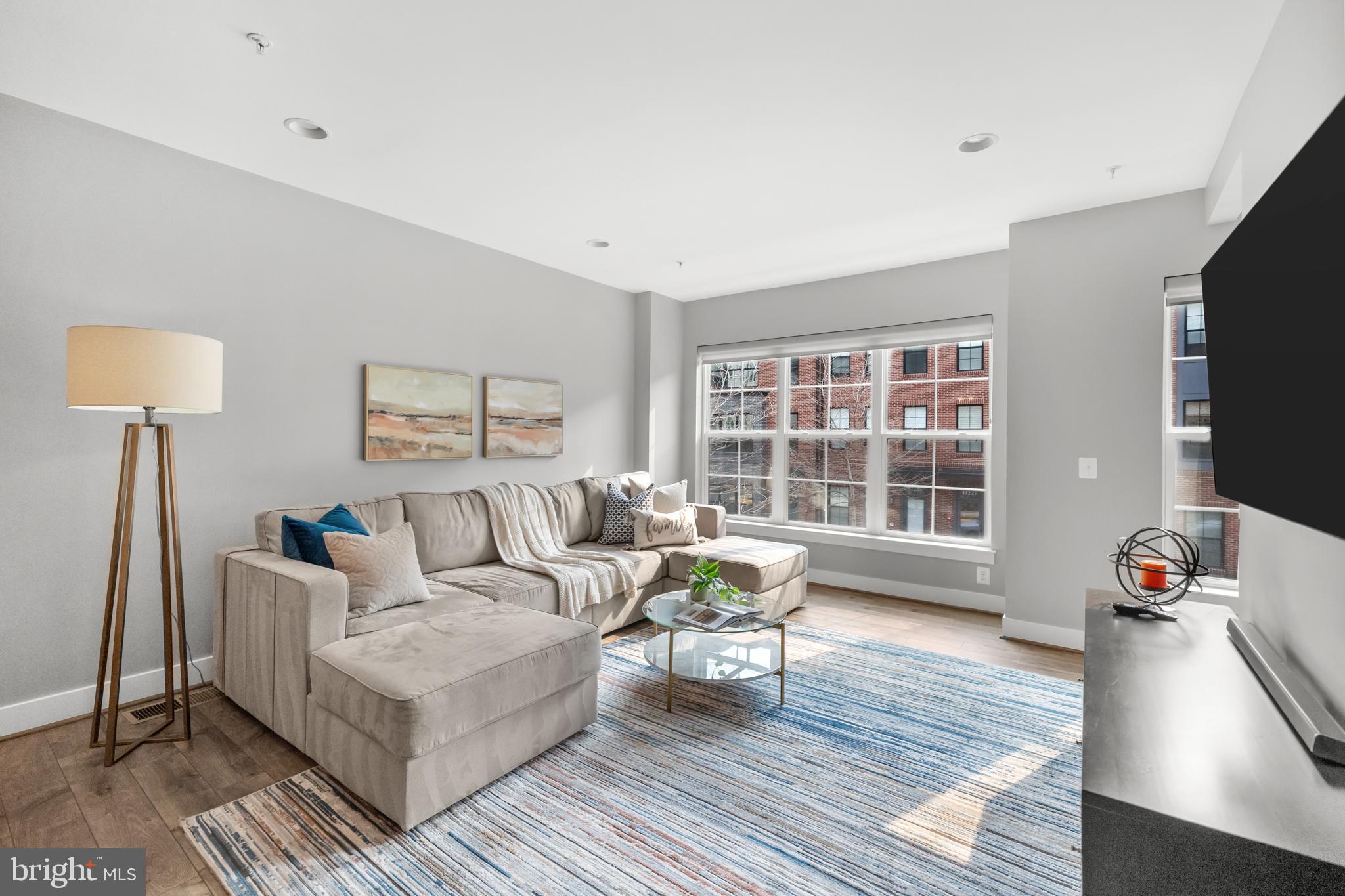 11226 Beaker Street Reston, VA 20190 - Photo 27 of 53 a living room with furniture and a flat screen tv