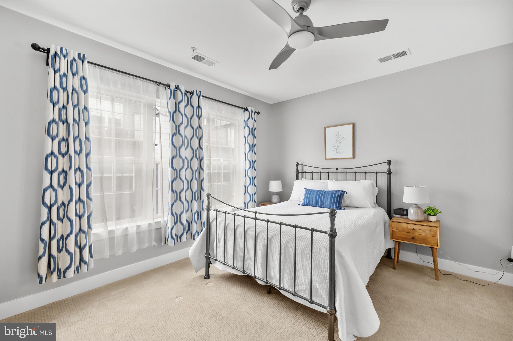 11226 Beaker Street Reston, VA 20190 - Photo 28 of 53 a bedroom with a bed and a lamp