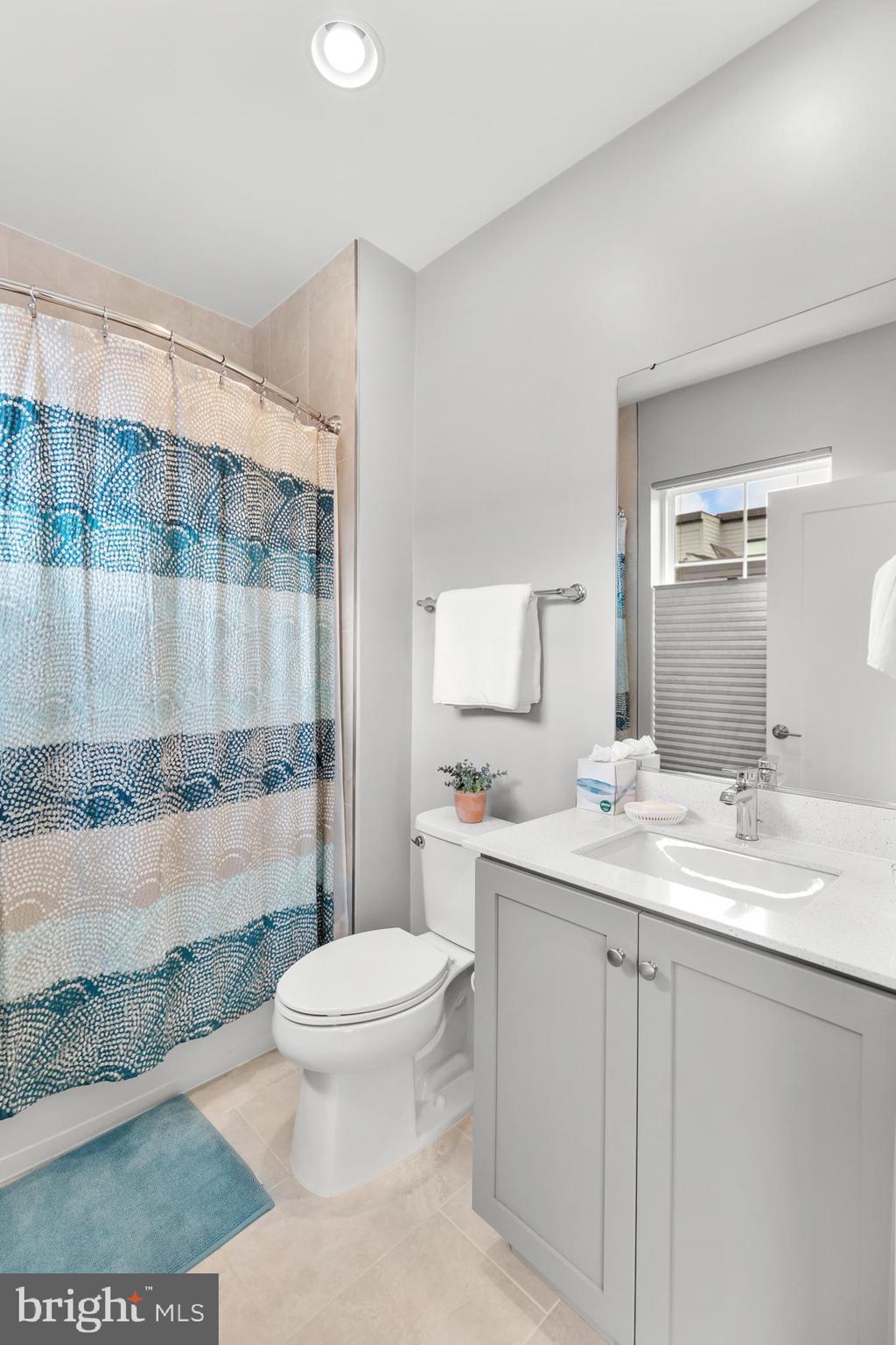 11226 Beaker Street Reston, VA 20190 - Photo 34 of 53 a bathroom with a sink a toilet and shower