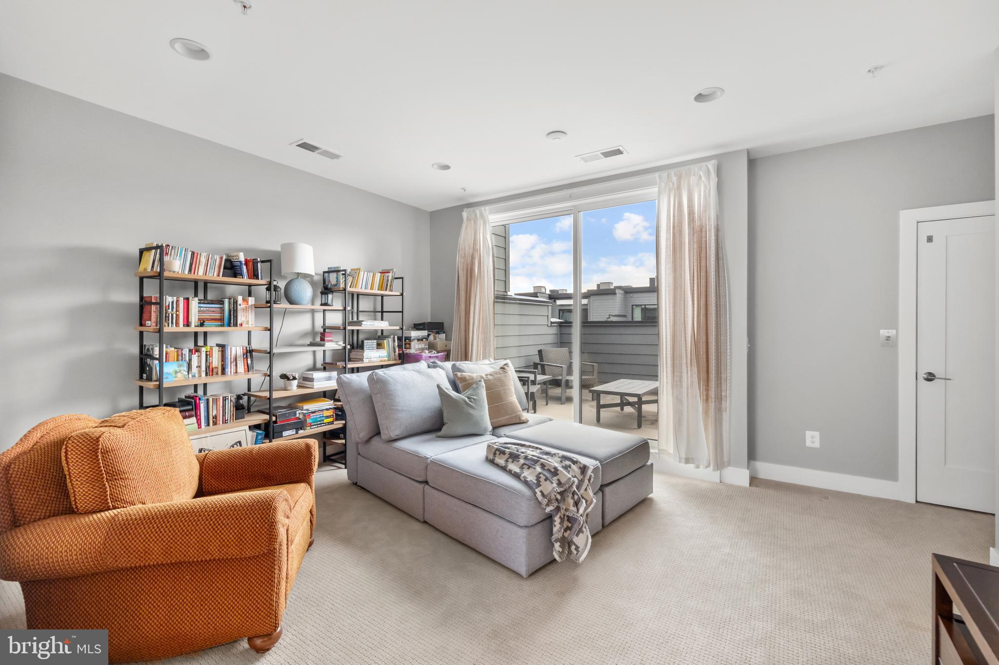 11226 Beaker Street Reston, VA 20190 - Photo 35 of 53 a living room with furniture and a large window