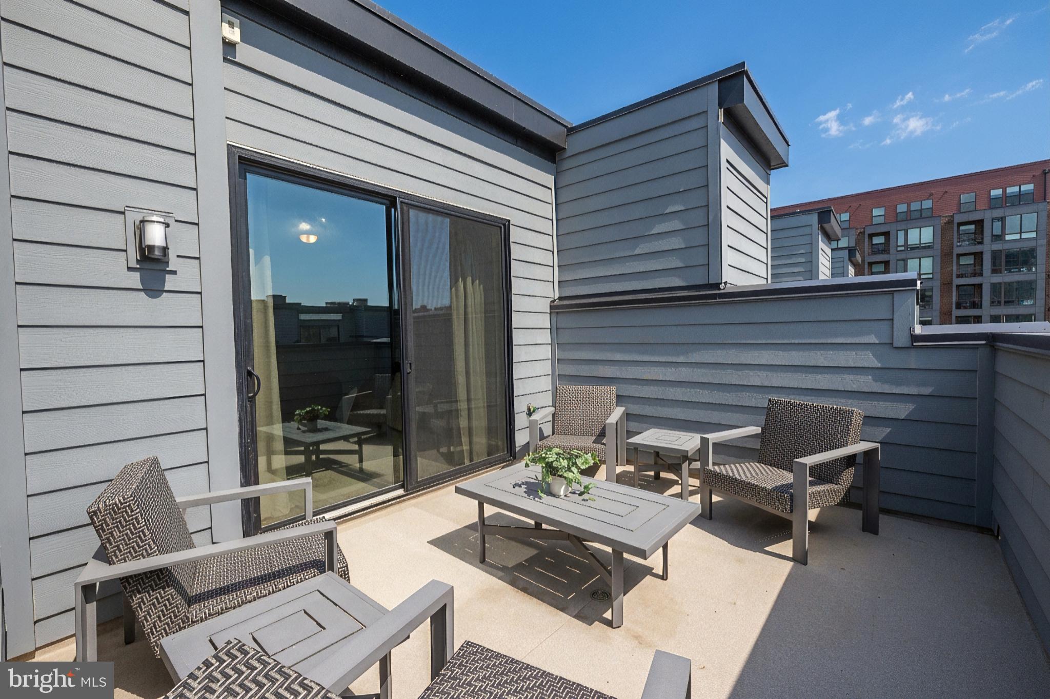 11226 Beaker Street Reston, VA 20190 - Photo 45 of 53 a backyard of a house with seating space