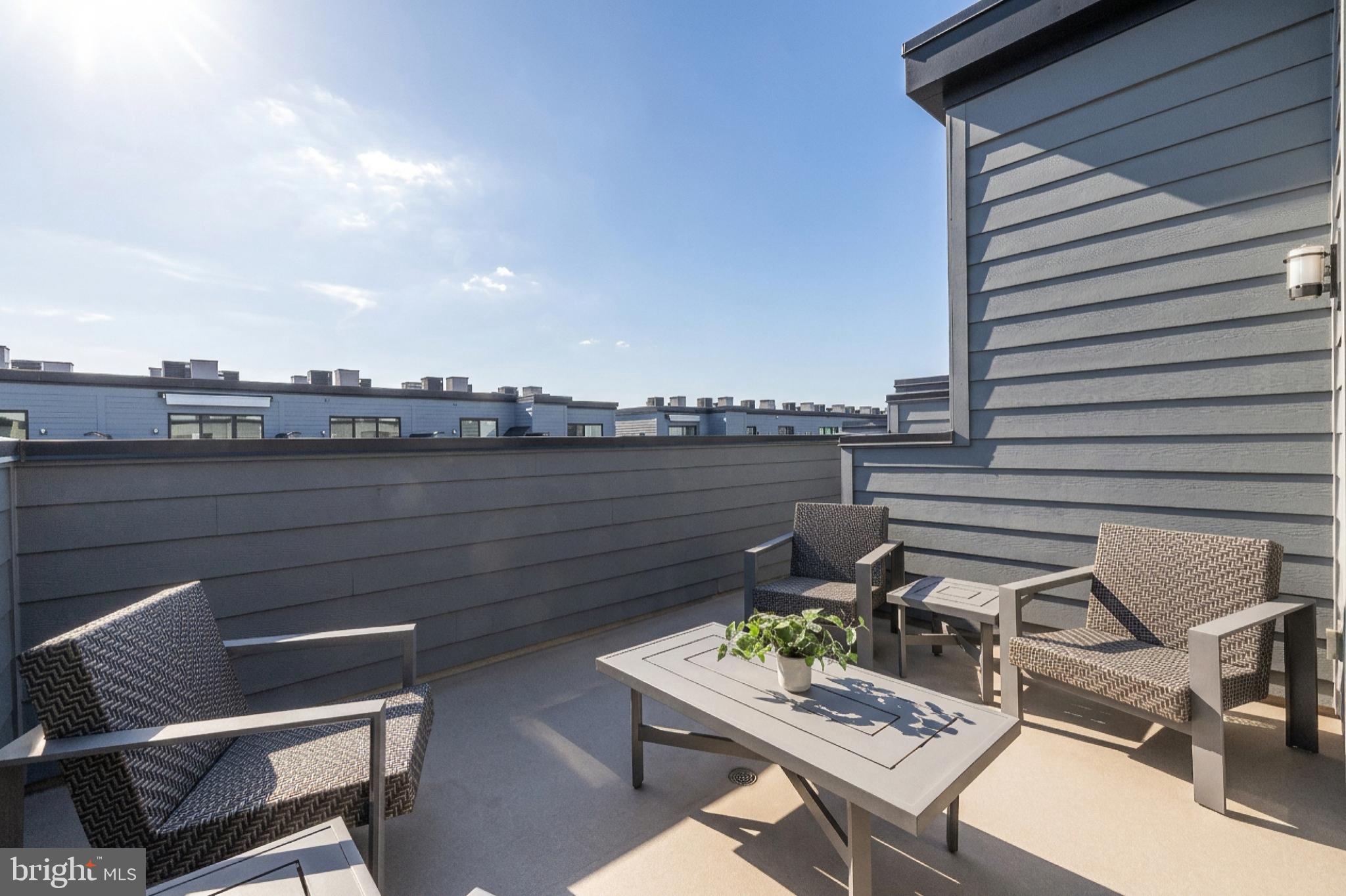 11226 Beaker Street Reston, VA 20190 - Photo 46 of 53 a view of a terrace with furniture