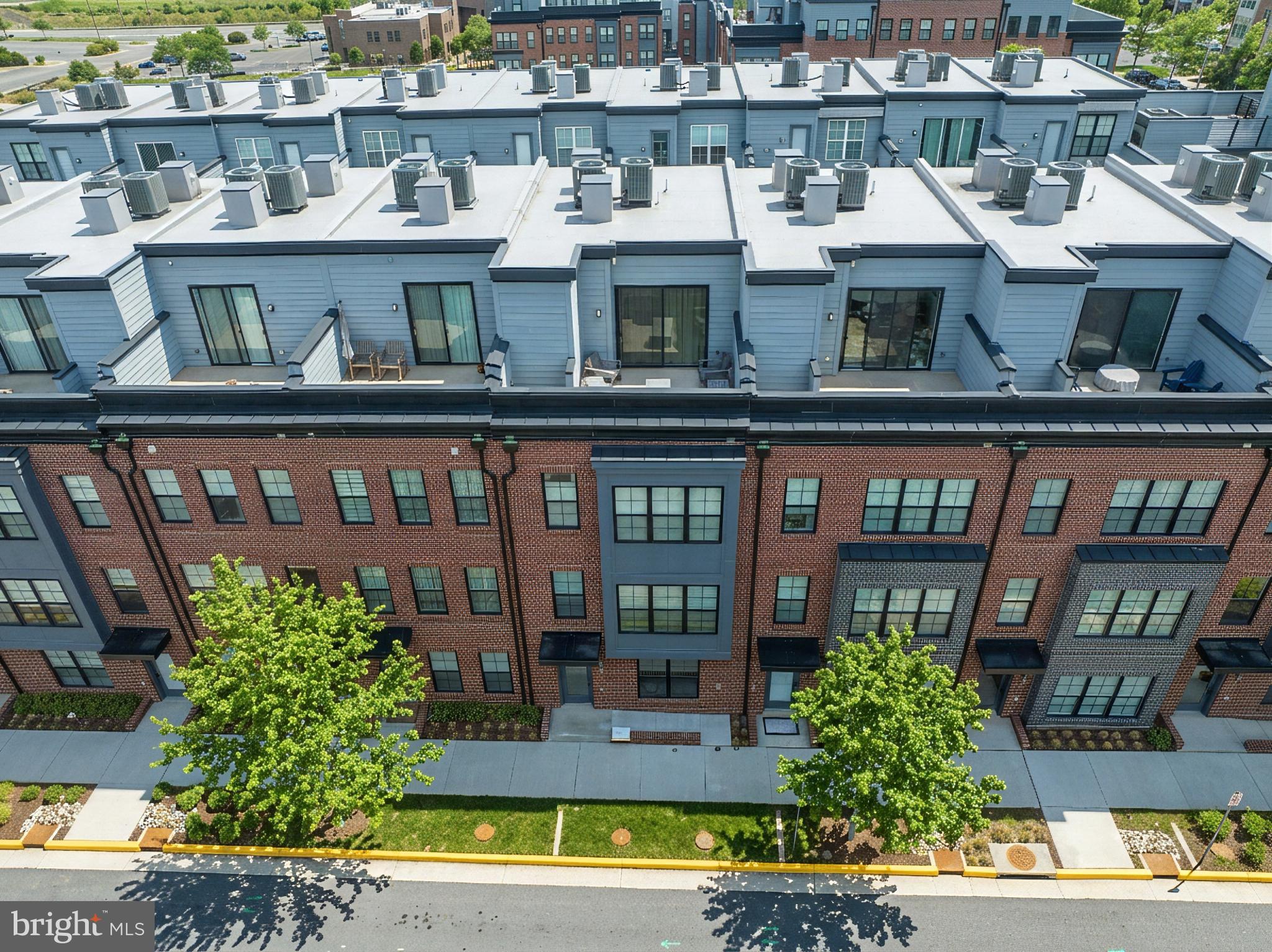 11226 Beaker Street Reston, VA 20190 - Photo 47 of 53 a front view of a multi story residential apartment building