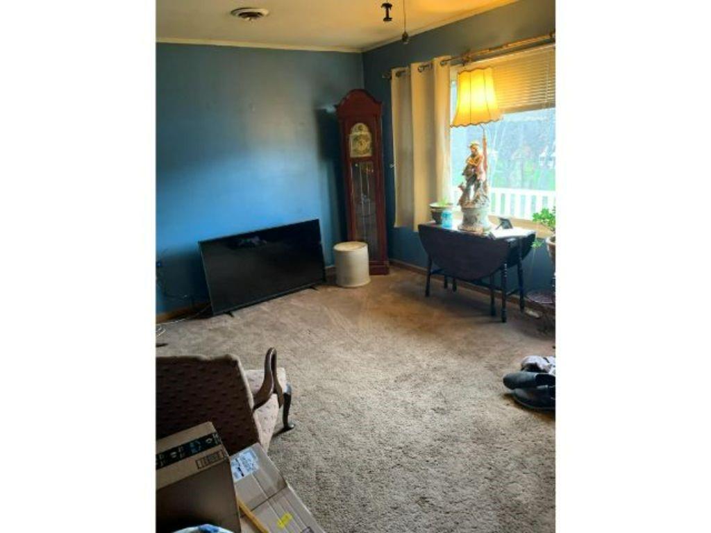 773 McClane Farm Road Washington, PA 15301 - Photo 4 of 12 a living room with furniture and a fireplace